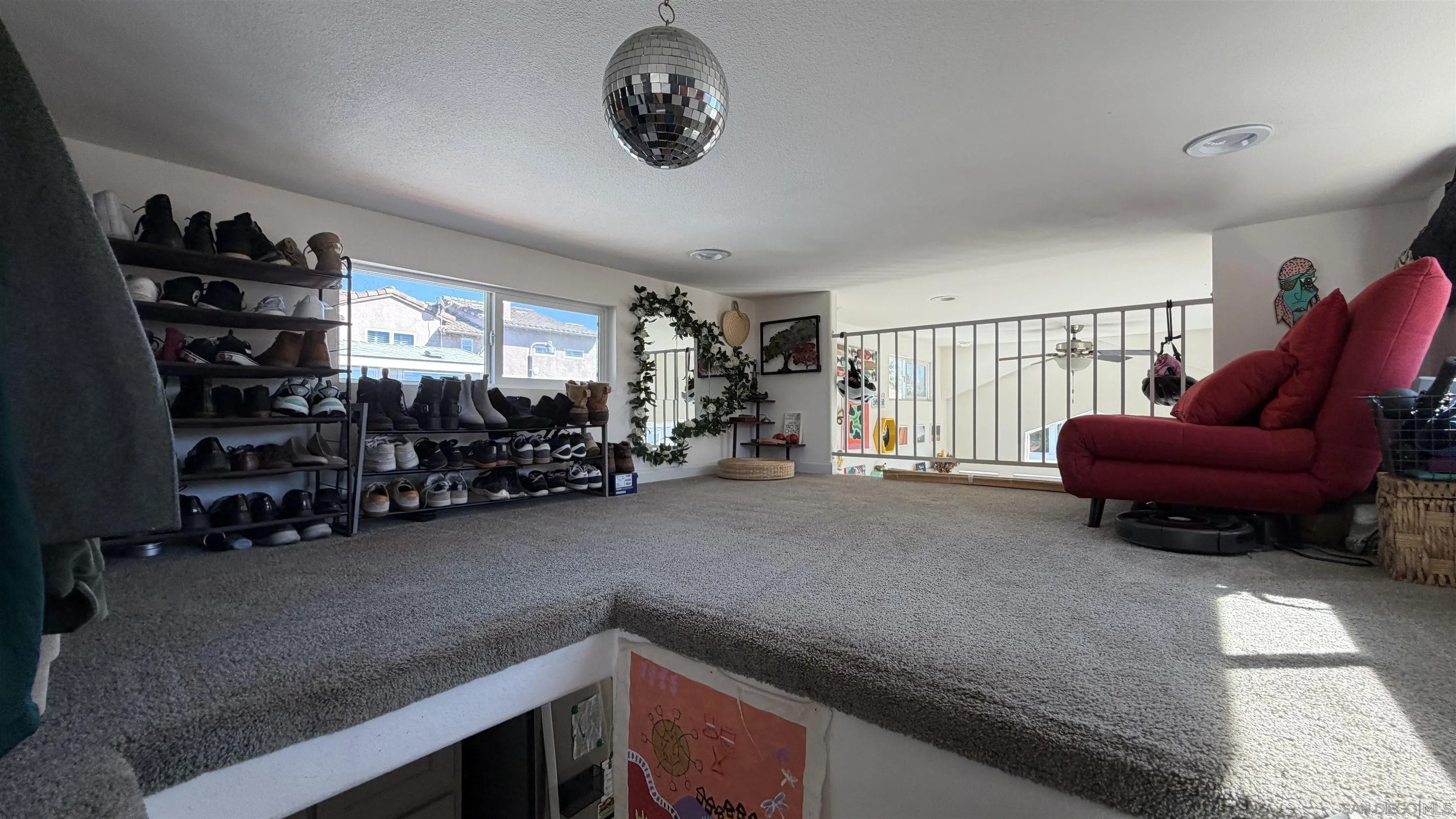 1549 North Vulcan Avenue, Unit 82 Encinitas, CA 92024 - Photo 22 of 32 a living room with furniture a air conditioner and a window