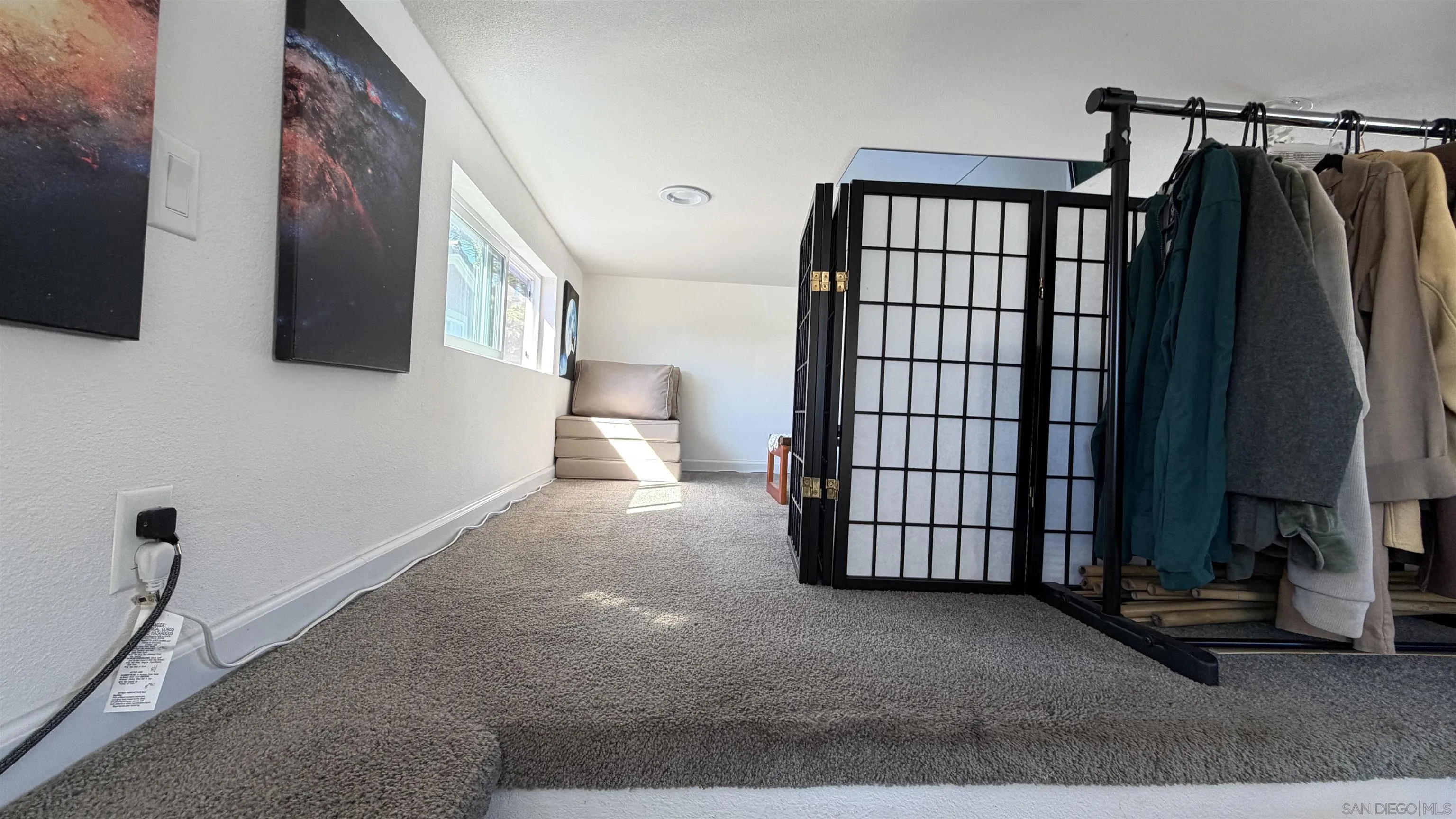 1549 North Vulcan Avenue, Unit 82 Encinitas, CA 92024 - Photo 24 of 32 a view of a living room and bathroom