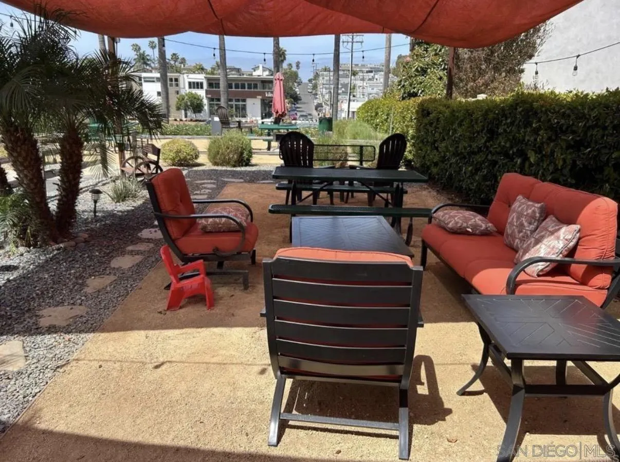 1549 North Vulcan Avenue, Unit 82 Encinitas, CA 92024 - Photo 31 of 32 a outdoor living space with patio furniture and a potted plant