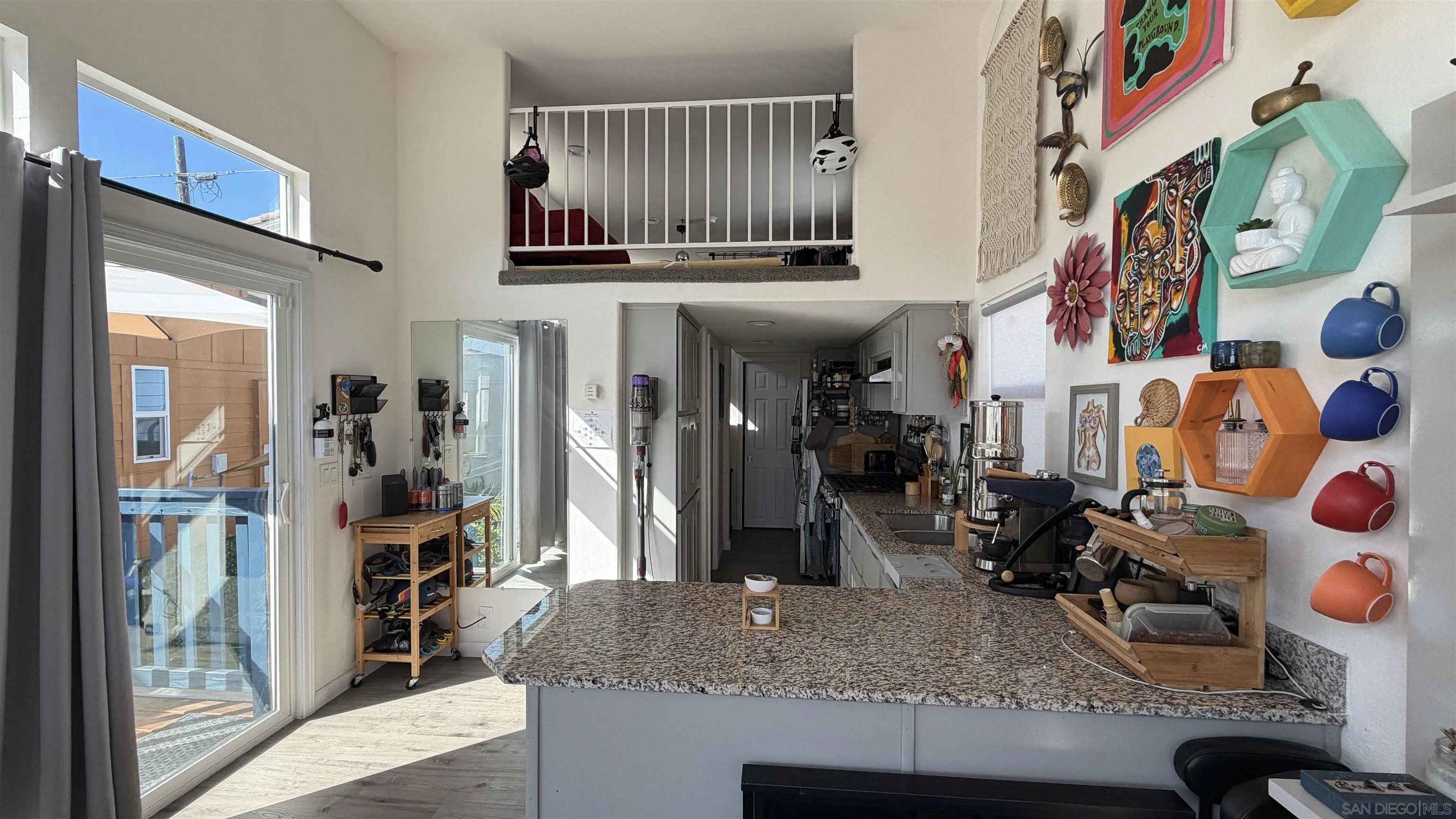 1549 North Vulcan Avenue, Unit 82 Encinitas, CA 92024 - Photo 4 of 32 a view of a kitchen with stainless steel appliances granite countertop a sink and a refrigerator