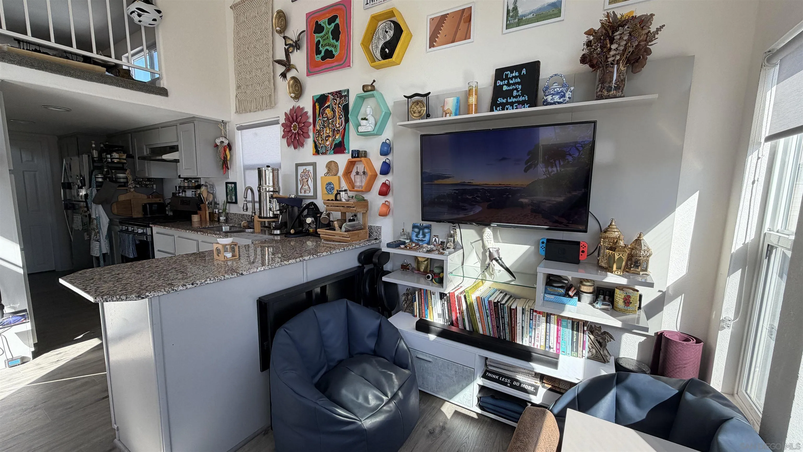 1549 North Vulcan Avenue, Unit 82 Encinitas, CA 92024 - Photo 7 of 32 a room with furniture and a flat screen tv