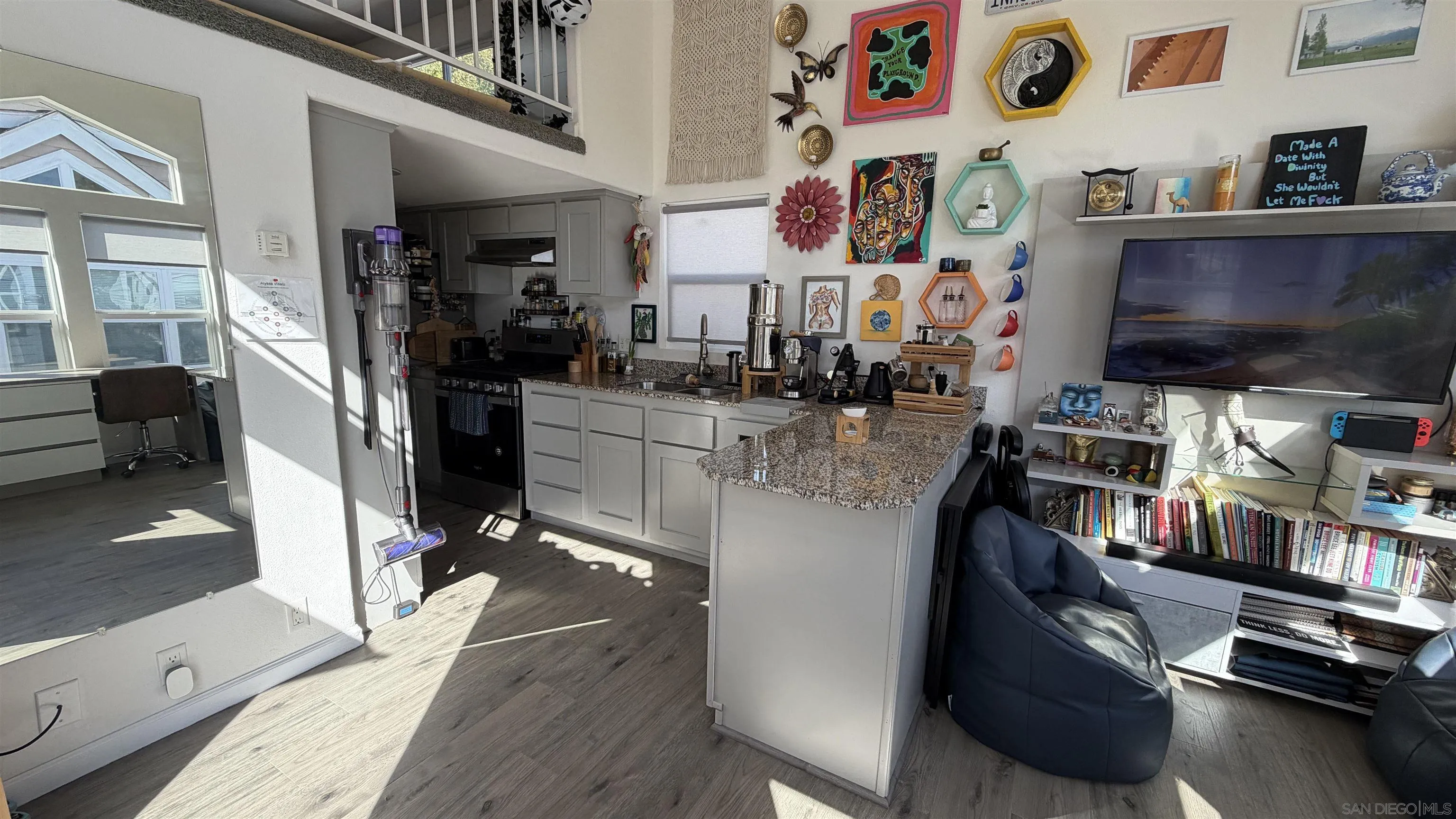 1549 North Vulcan Avenue, Unit 82 Encinitas, CA 92024 - Photo 9 of 32 a living room with lots of furniture and a flat screen tv