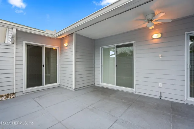 a view of an empty room with a bathroom