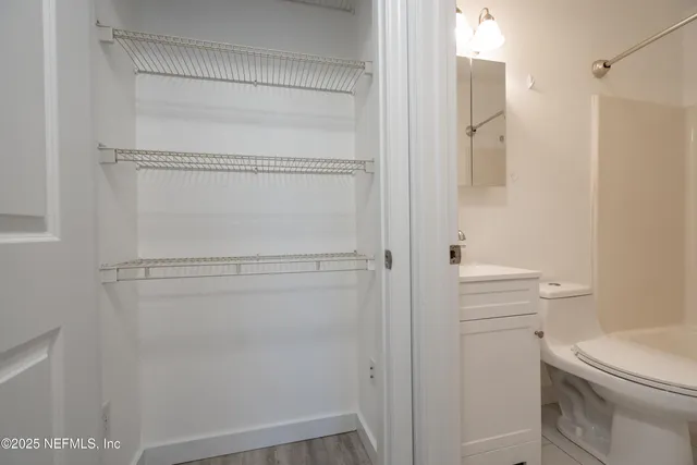 a bathroom with a shower toilet and sink