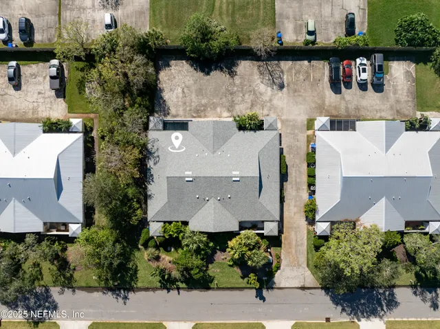 an aerial view of house with yard