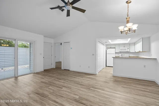 a view of a kitchen with a sink and cabinet area