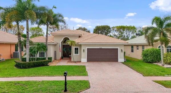 a view of a house with backyard porch and patio