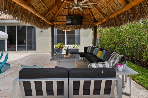 a view of a house with backyard sitting area and porch