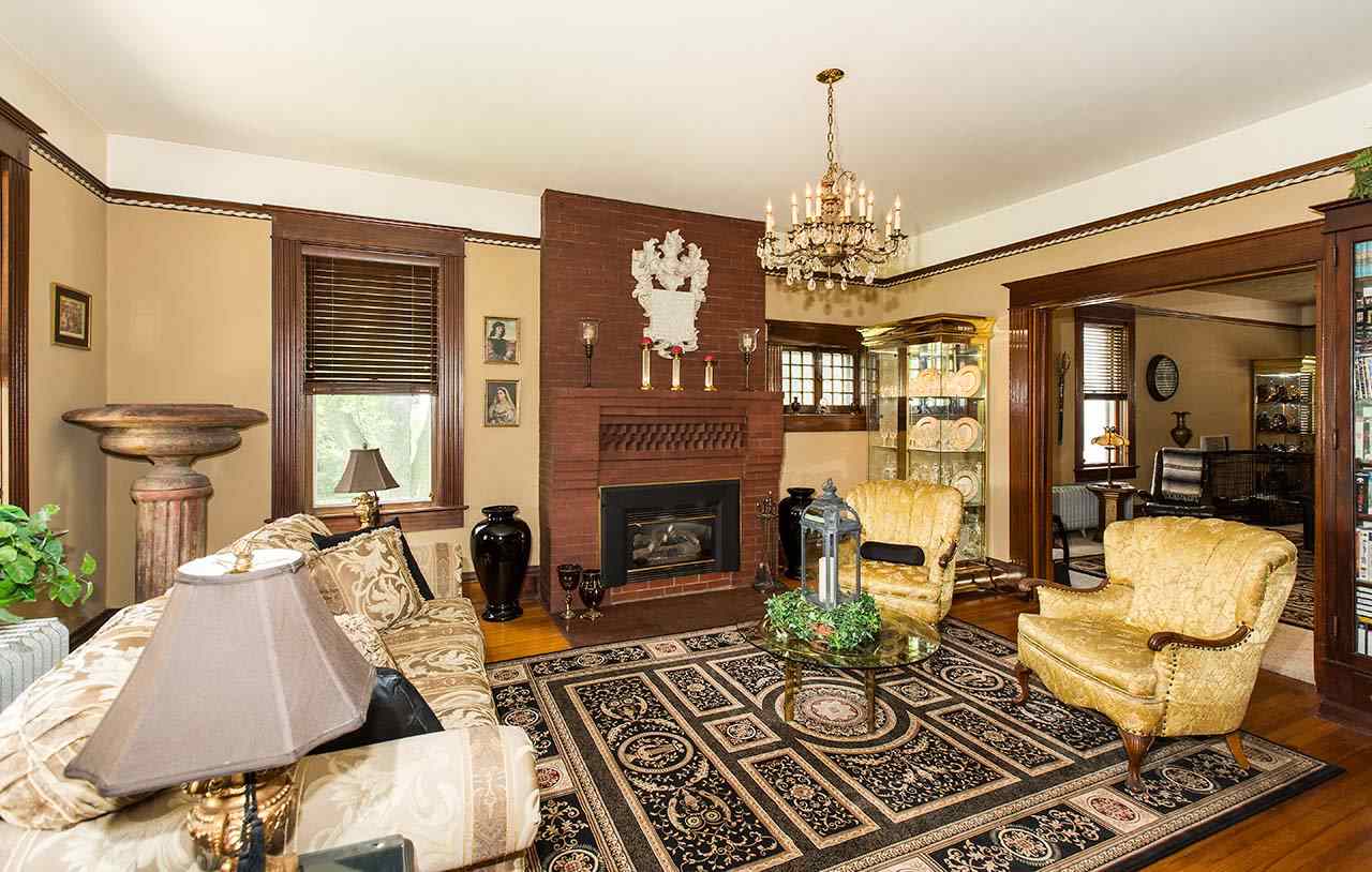 3604 Spring Creek Road Rockford, IL 61107 - Photo 2 of 24 a living room with furniture and a chandelier