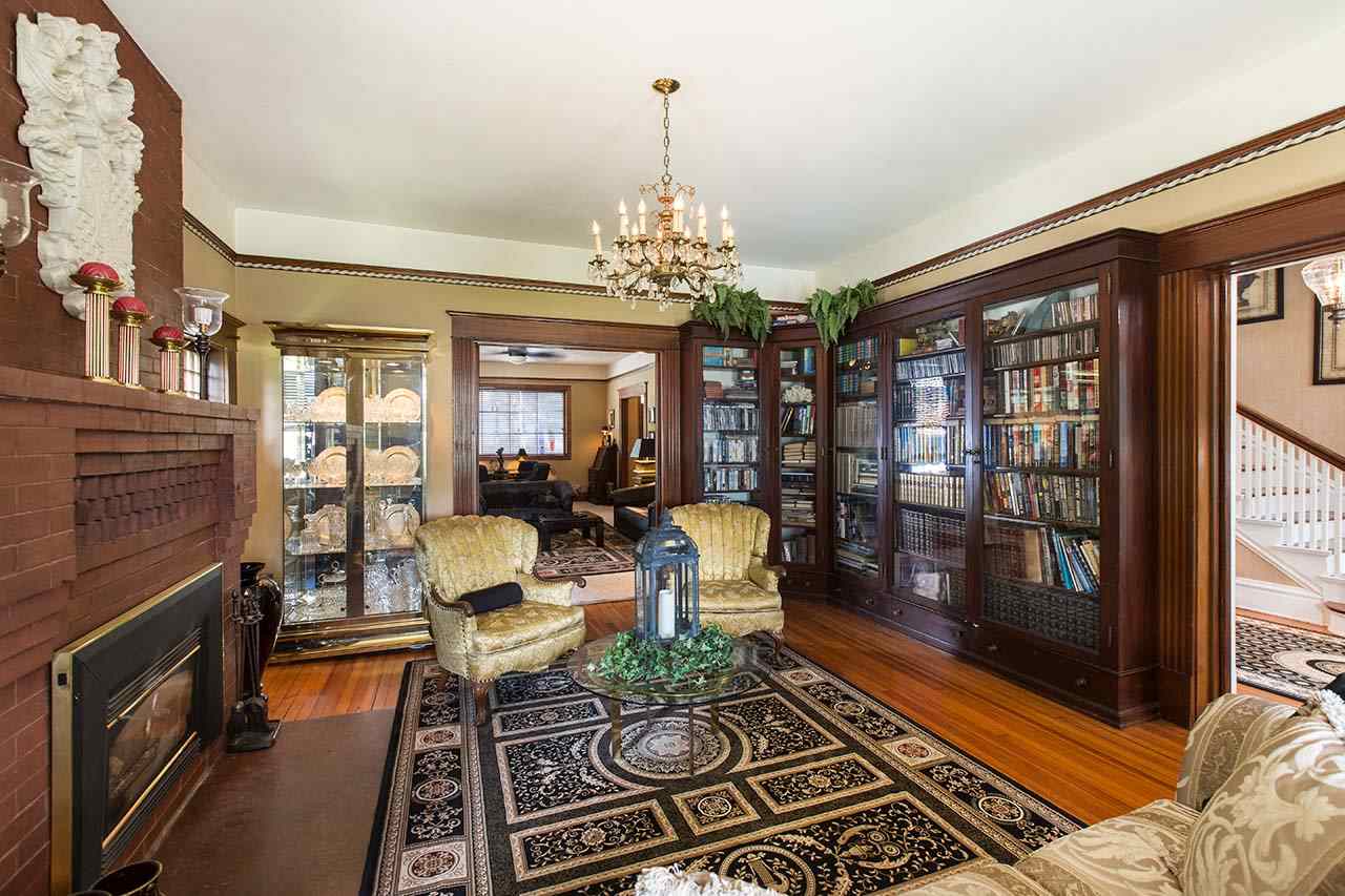 3604 Spring Creek Road Rockford, IL 61107 - Photo 3 of 24 a living room with furniture fireplace and a chandelier