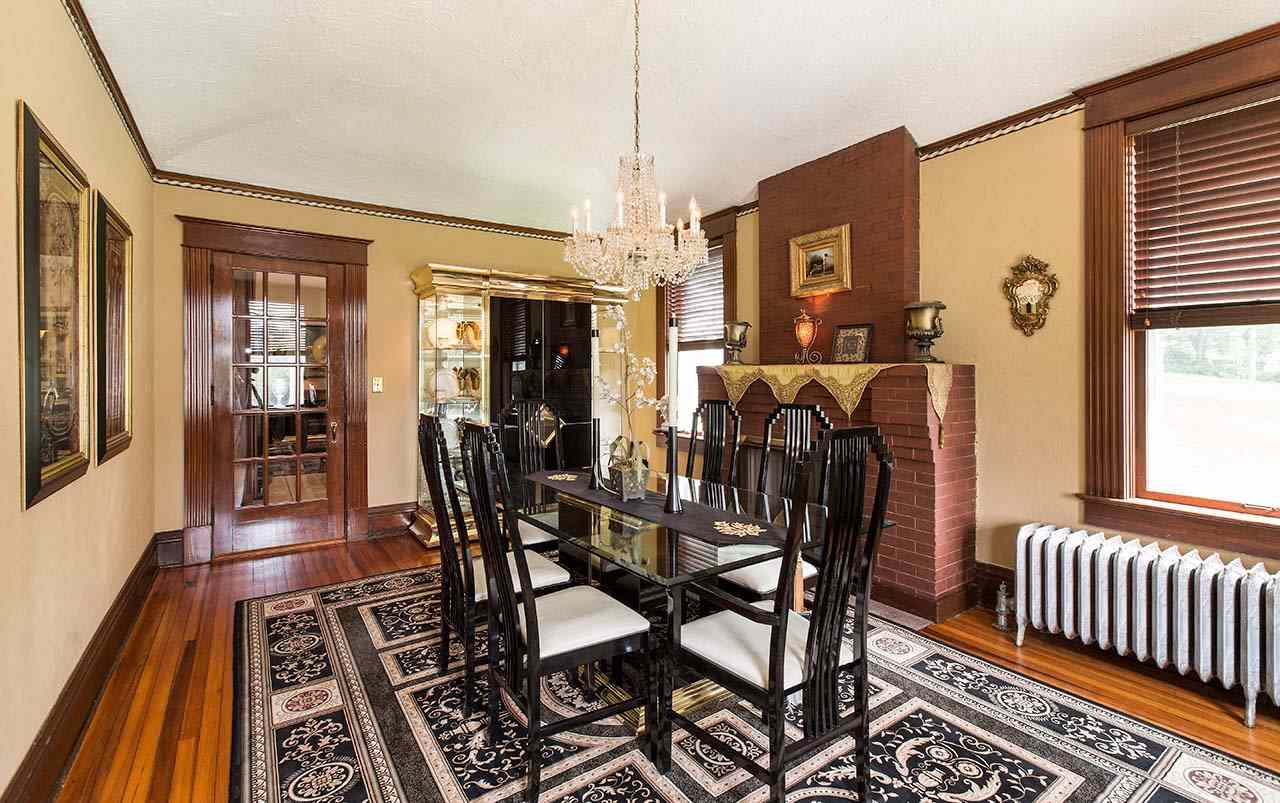 3604 Spring Creek Road Rockford, IL 61107 - Photo 5 of 24 a view of a dining room with furniture window and wooden floor