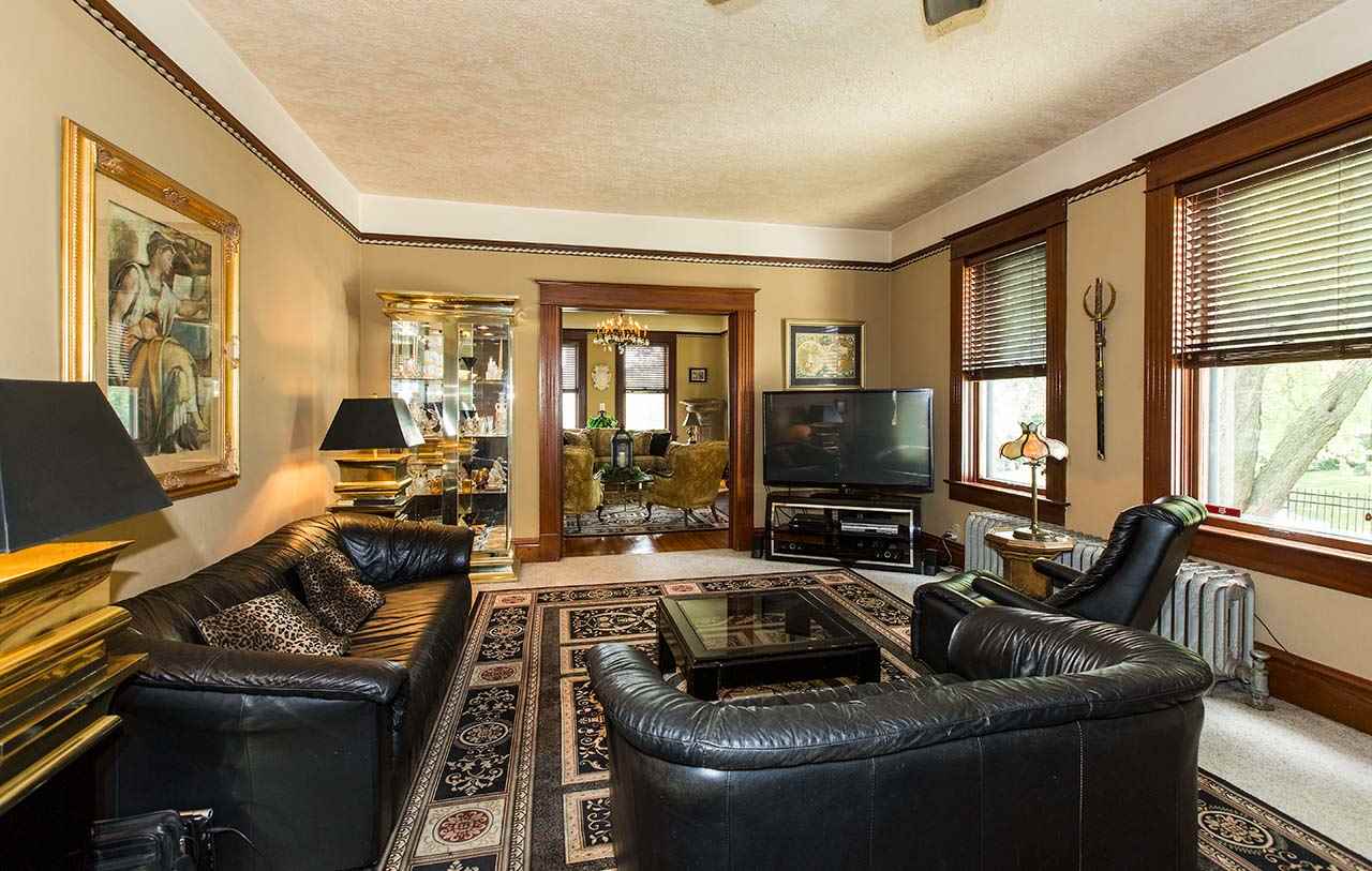 3604 Spring Creek Road Rockford, IL 61107 - Photo 7 of 24 a living room with furniture and a flat screen tv
