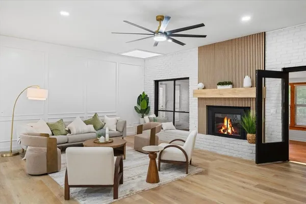 a living room with furniture and a fireplace