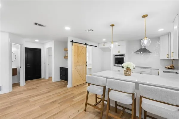 a kitchen with sink and cabinets