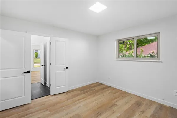 a view of storage and utility room with a window