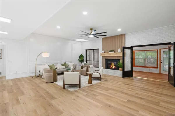 a living room with furniture fireplace and window