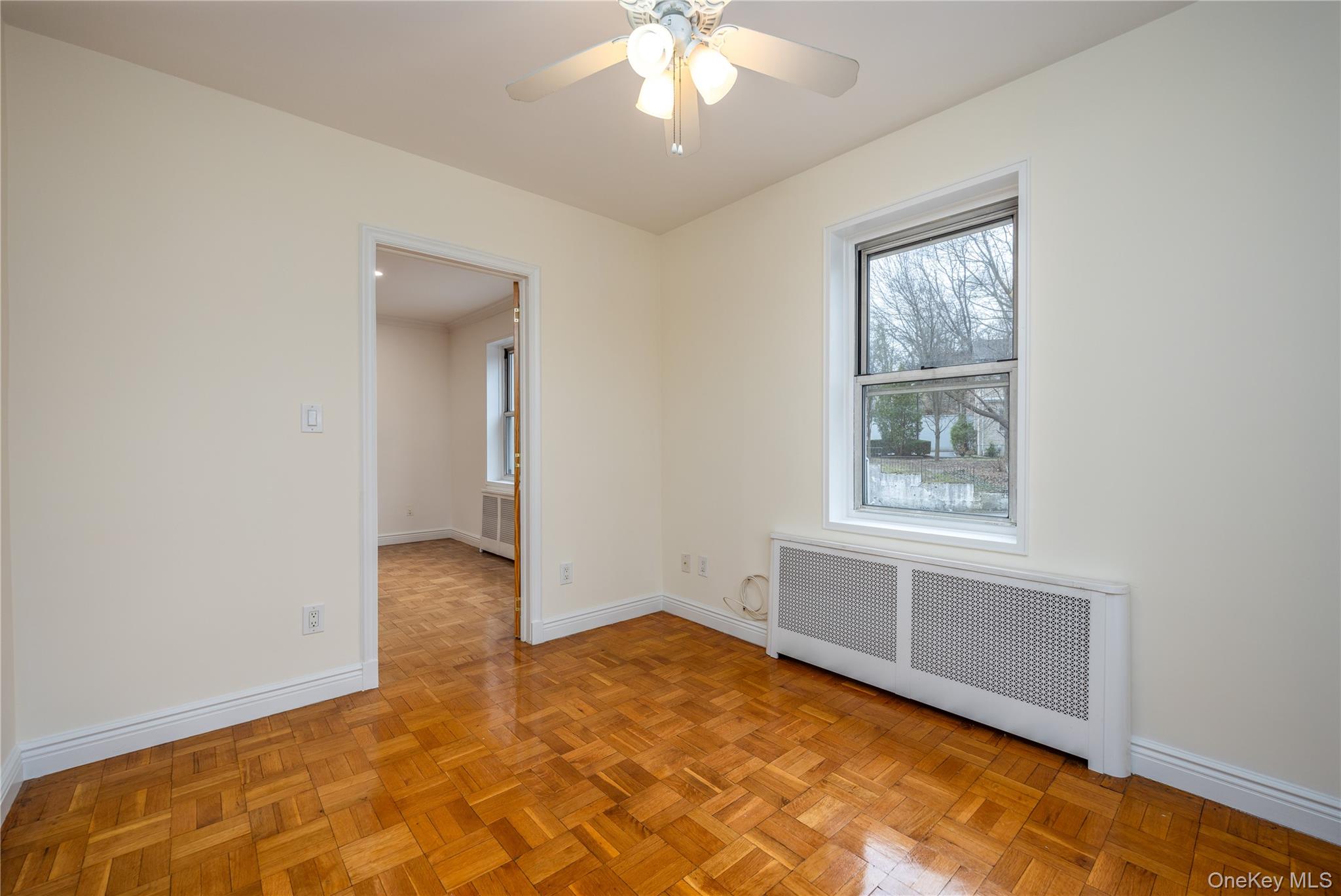 2303 Palmer Avenue, Unit F New Rochelle, NY 10801 - Photo 12 of 22 Second bedroom with baseboards, a ceiling fan, and radiator