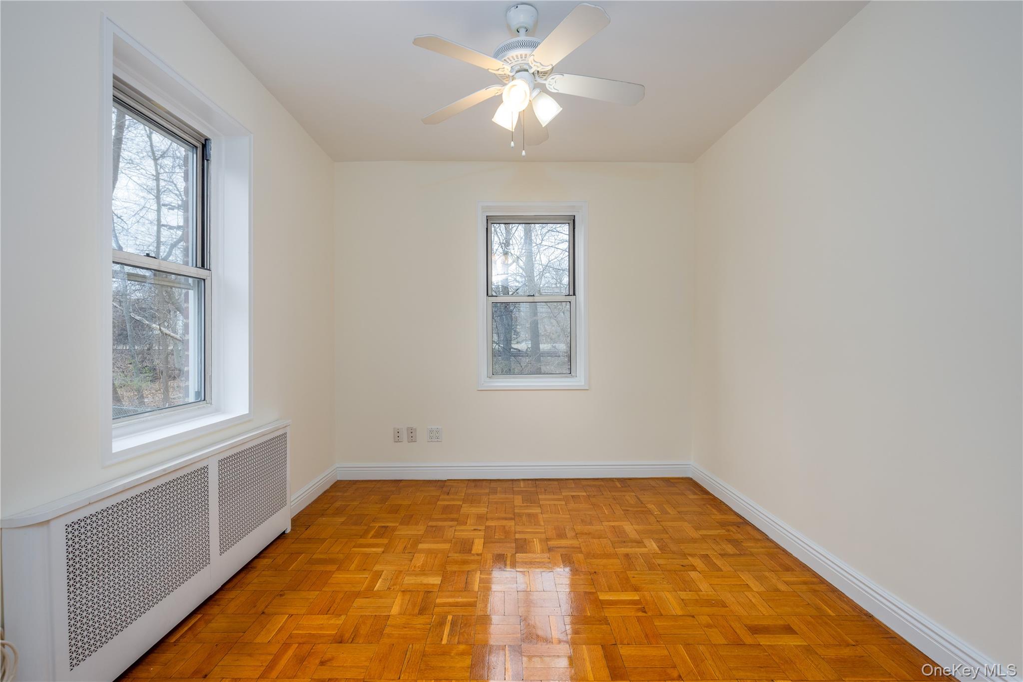 2303 Palmer Avenue, Unit F New Rochelle, NY 10801 - Photo 13 of 22 Second bedroom featuring radiator, baseboards, and a ceiling fan