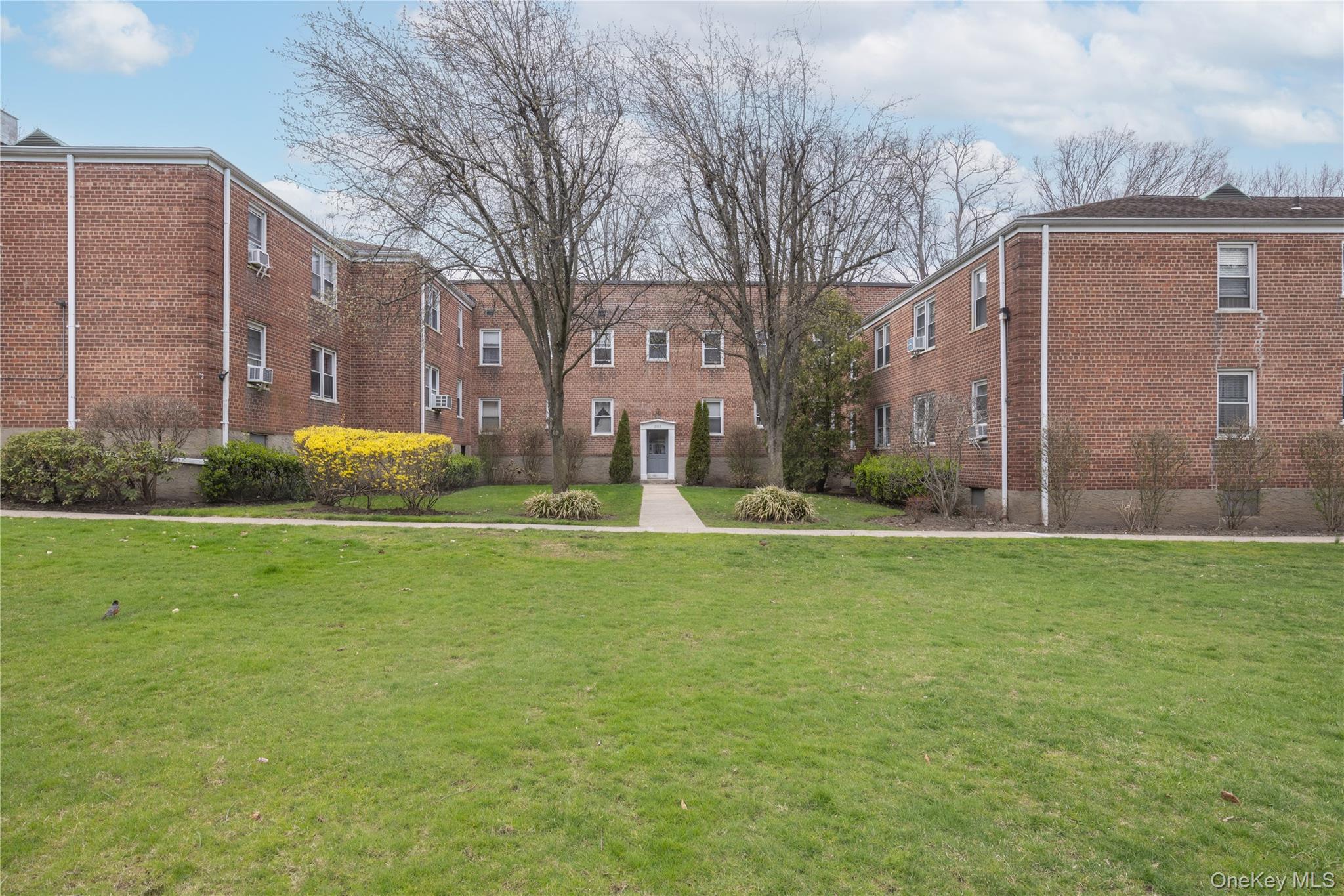 2303 Palmer Avenue, Unit F New Rochelle, NY 10801 - Photo 16 of 22 View of home's community featuring a yard