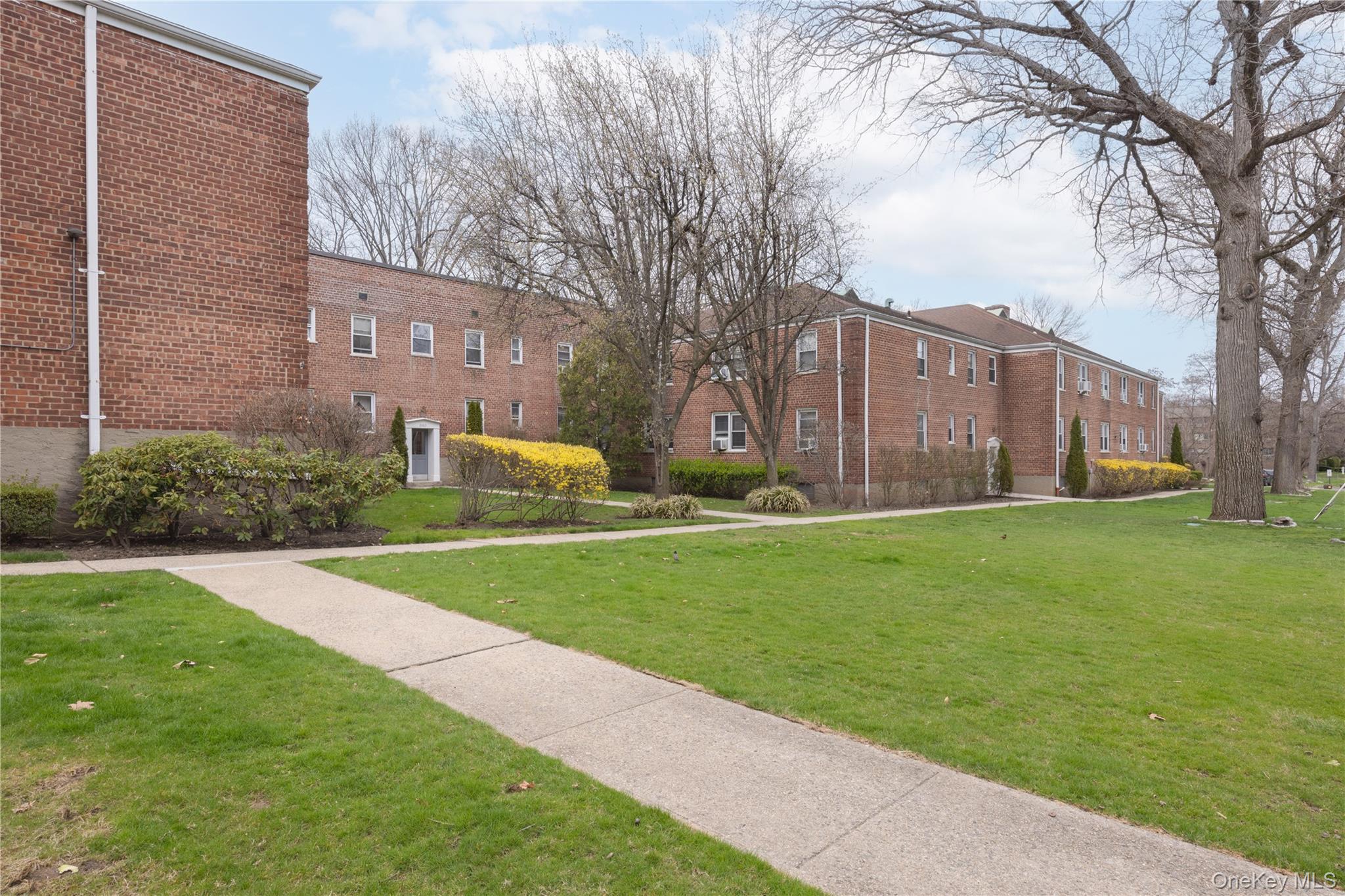 2303 Palmer Avenue, Unit F New Rochelle, NY 10801 - Photo 17 of 22 View of home's community featuring a lawn