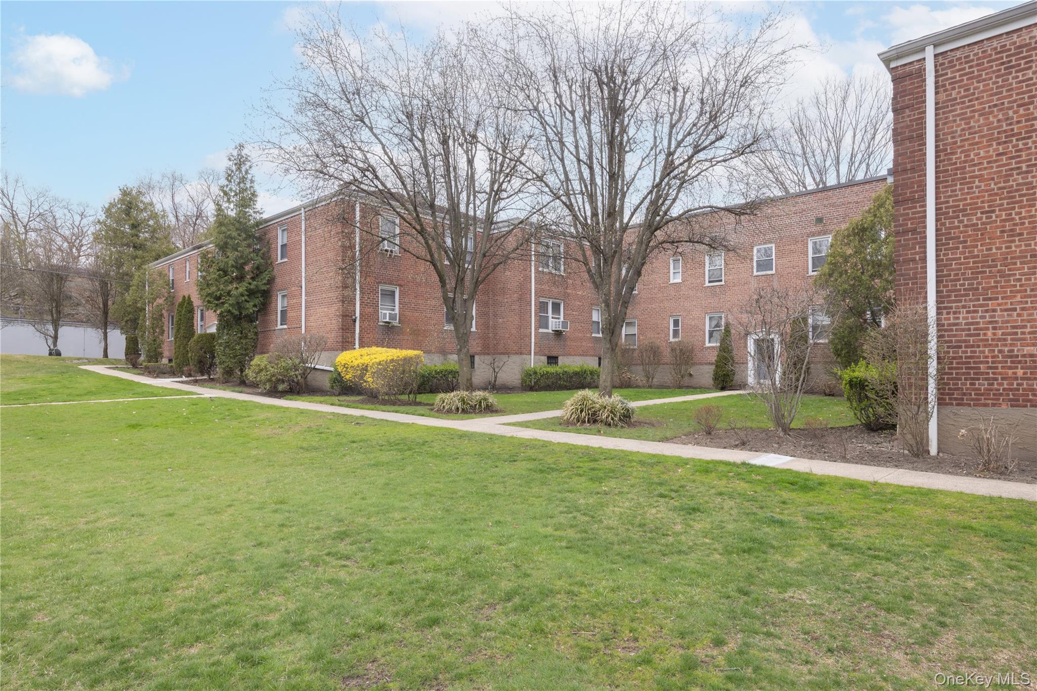 2303 Palmer Avenue, Unit F New Rochelle, NY 10801 - Photo 18 of 22 View of property's community with a lawn