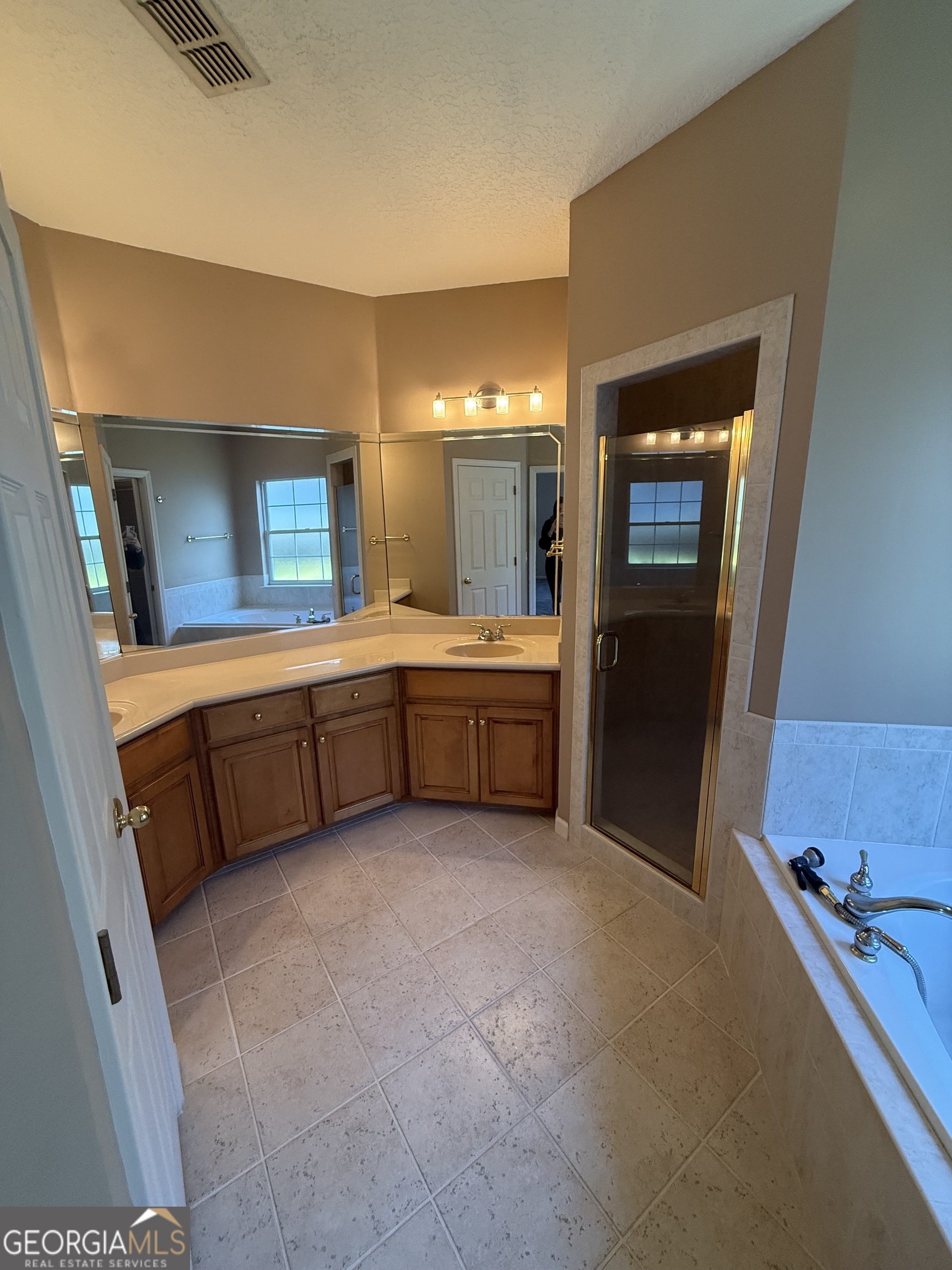 1403 Tanager Trail St. Marys, GA 31558 - Photo 22 of 24 a large bathroom with a tub sink and mirror