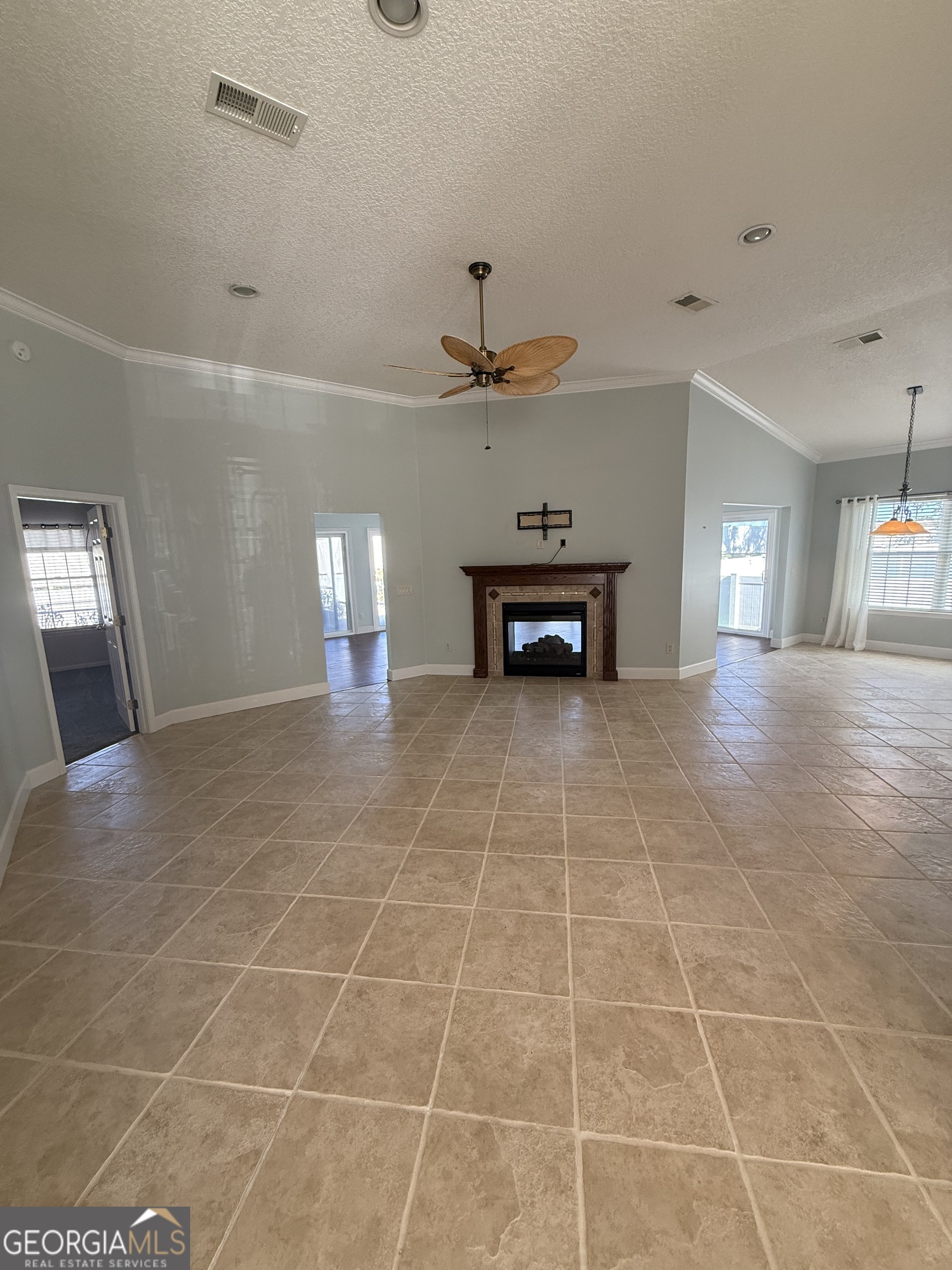 1403 Tanager Trail St. Marys, GA 31558 - Photo 5 of 24 a view of an empty room with a fireplace