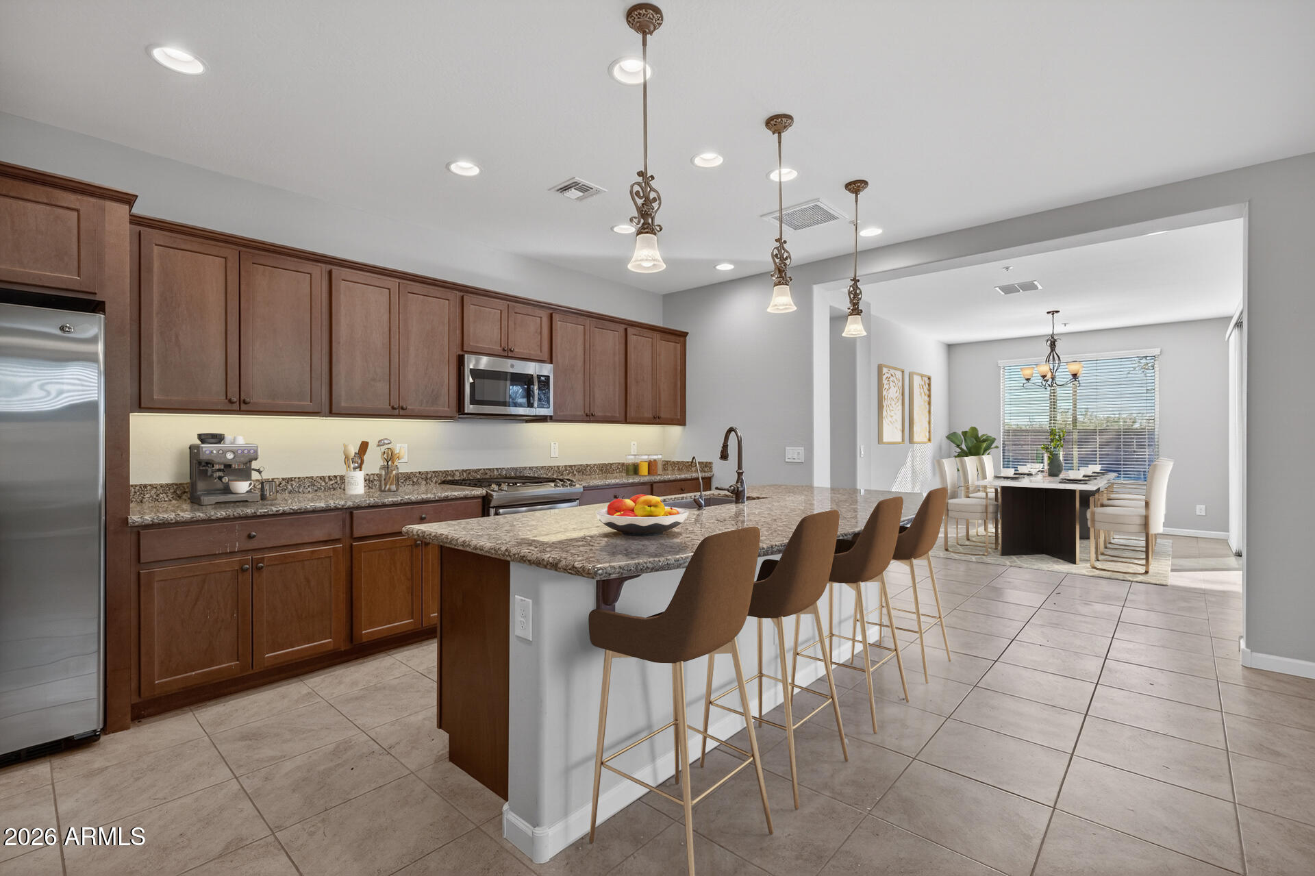 17963 East Silver Sage Lane Rio Verde, AZ 85263 - Photo 12 of 75 a kitchen with stainless steel appliances granite countertop a sink counter space chairs and a stove