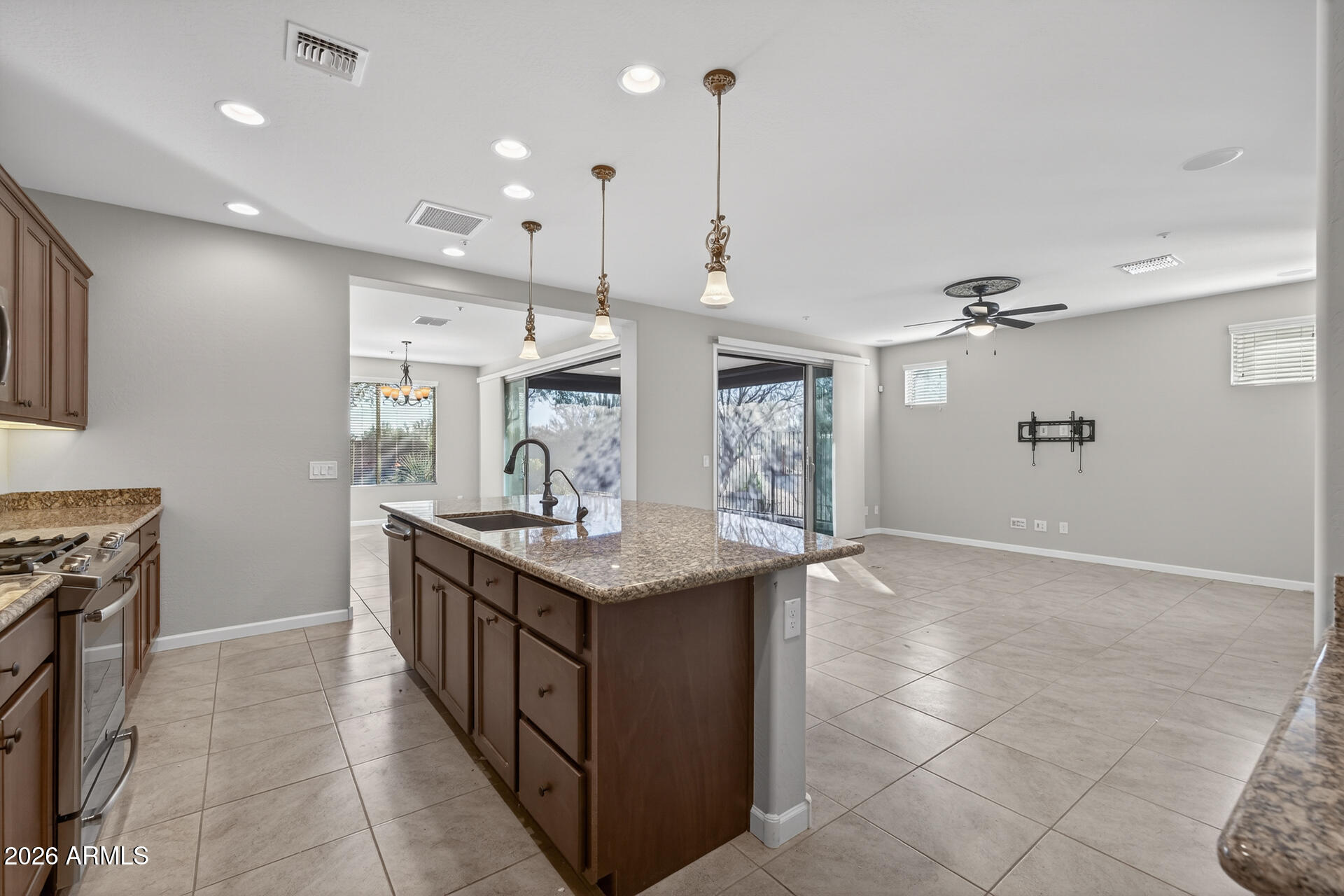 17963 East Silver Sage Lane Rio Verde, AZ 85263 - Photo 13 of 75 a kitchen with stainless steel appliances granite countertop a sink a counter space and wooden floor