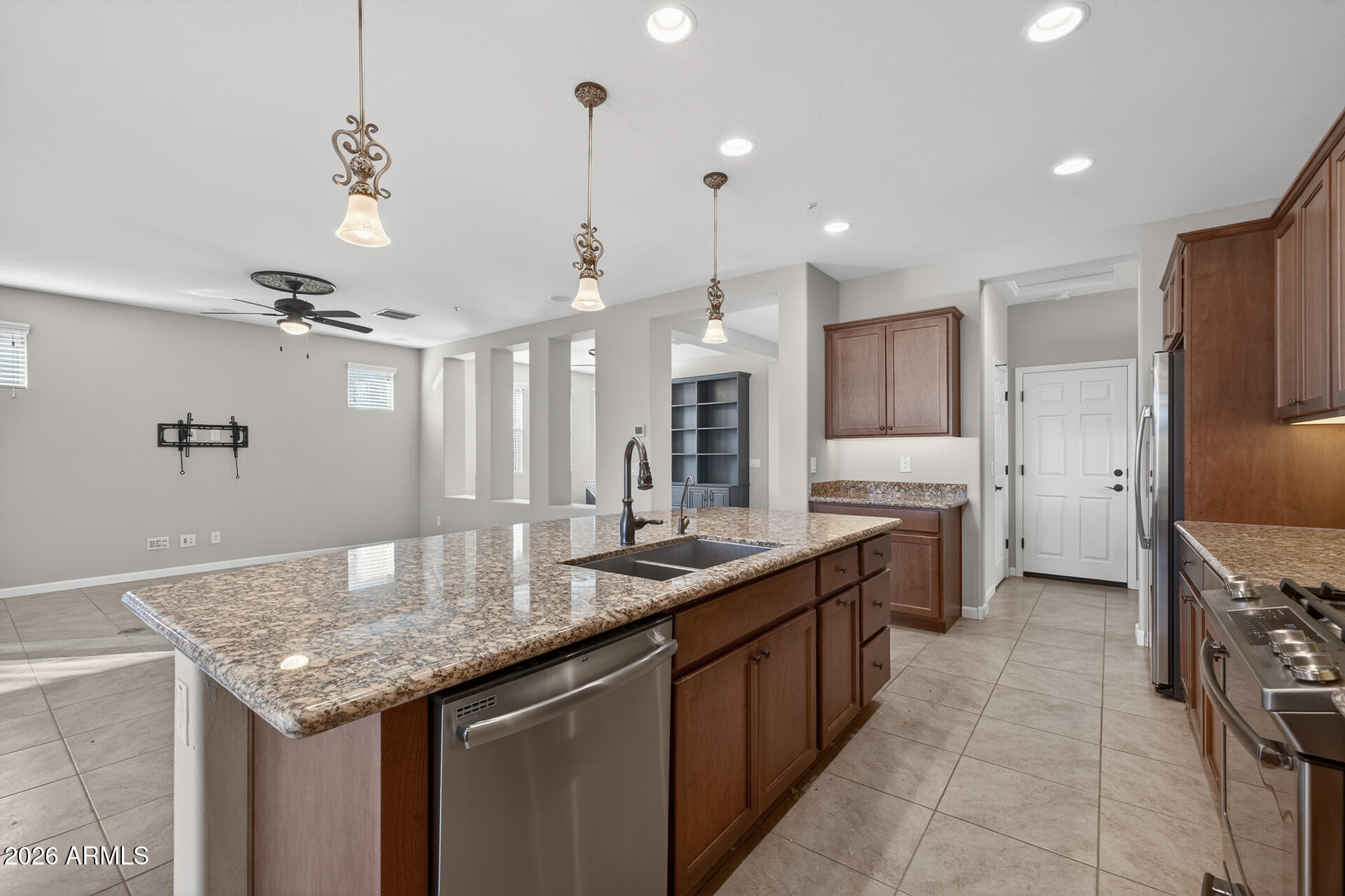 17963 East Silver Sage Lane Rio Verde, AZ 85263 - Photo 14 of 75 a kitchen with granite countertop kitchen island stainless steel appliances a sink stove and refrigerator