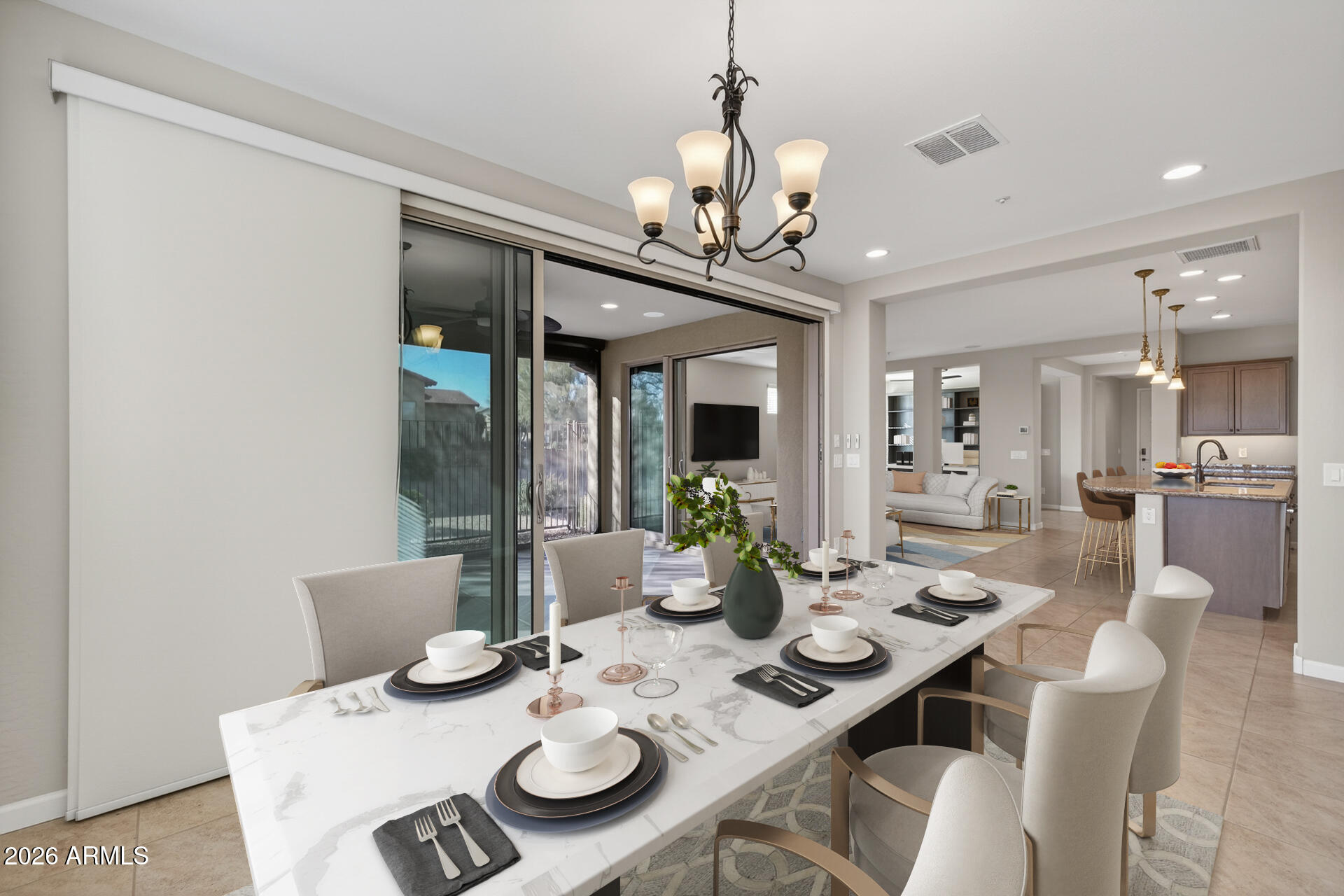 17963 East Silver Sage Lane Rio Verde, AZ 85263 - Photo 16 of 75 a view of a dining room with furniture wooden floor and chandelier