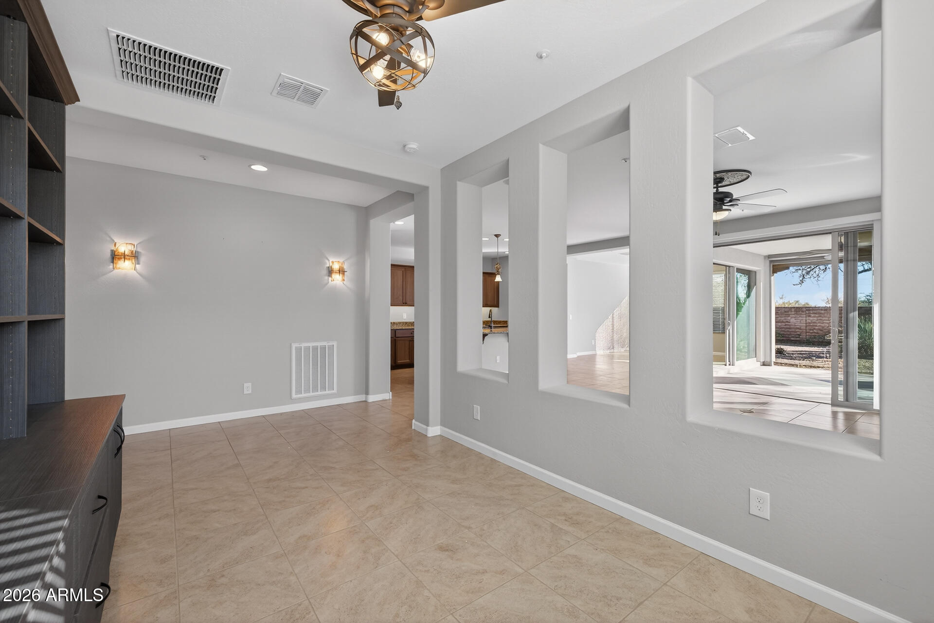 17963 East Silver Sage Lane Rio Verde, AZ 85263 - Photo 6 of 75 wooden floor in an empty room with a window