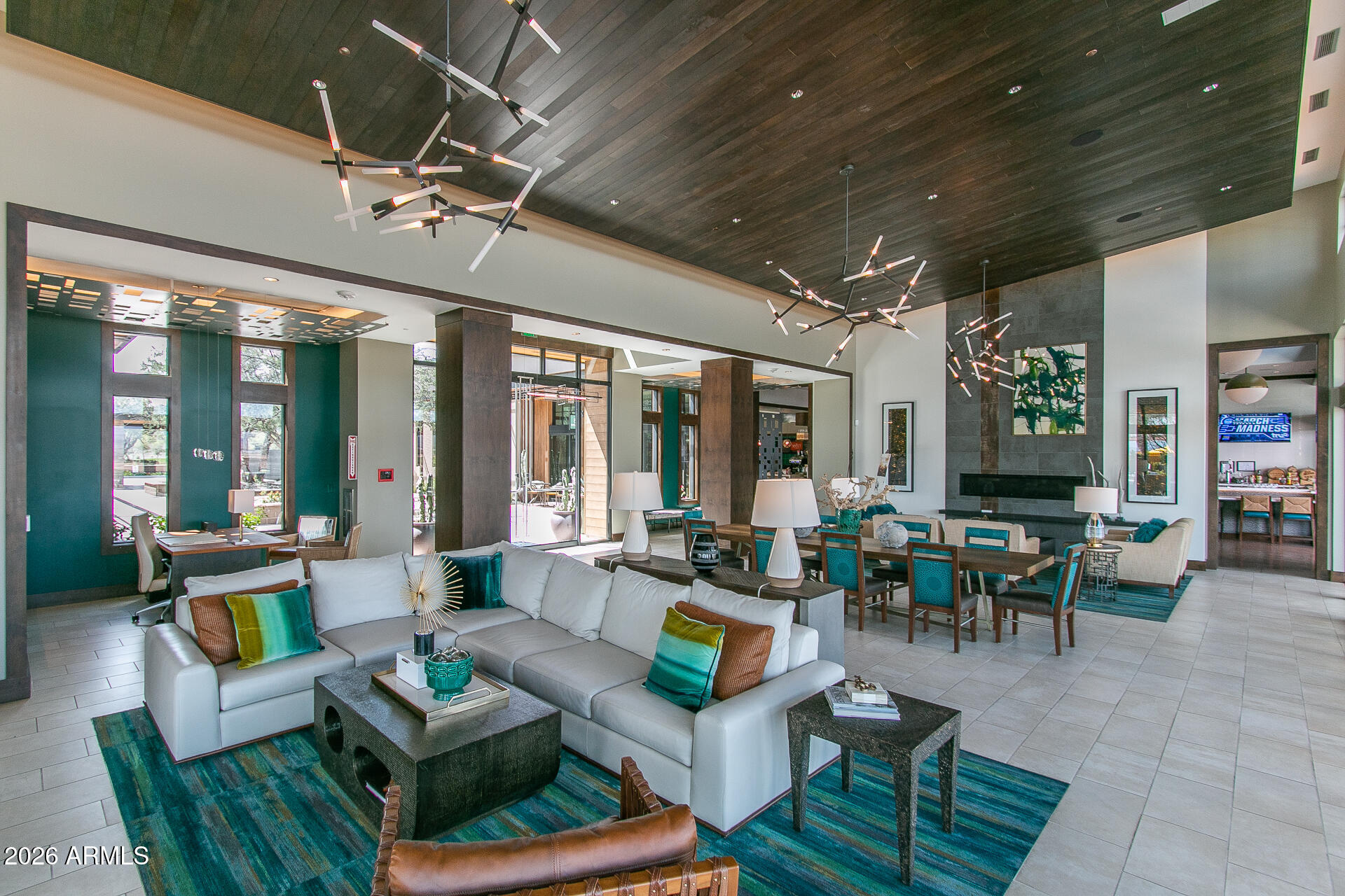 17963 East Silver Sage Lane Rio Verde, AZ 85263 - Photo 67 of 75 a living room with patio furniture and a chandelier