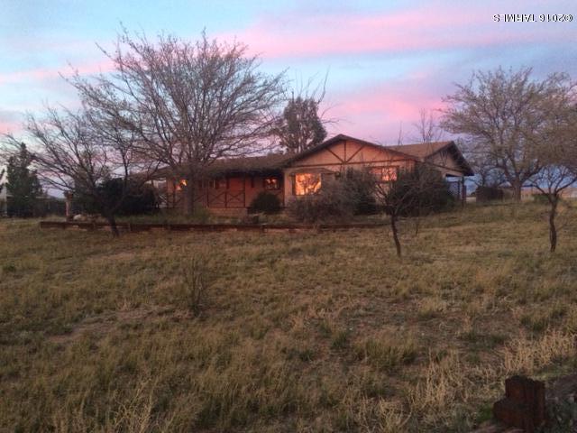 331 North Pima Benson, AZ 85602 - Photo 1 of 7 a view of a yard with a house