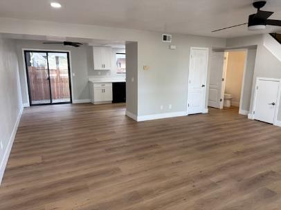 31 West 6th Street, Unit 1 Tracy, CA 95376 - Photo 1 of 12 an empty room with wooden floor and windows