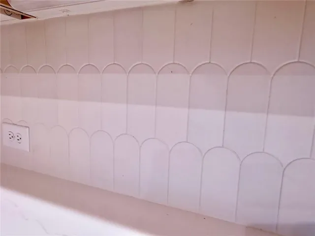 a kitchen with stainless steel appliances granite countertop a stove a refrigerator a sink a oven and a center island with wooden floor