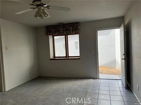 a view of an empty room and window