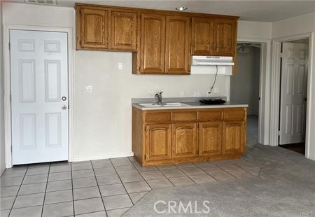 6818 Kittyhawk Avenue Hesperia, CA 92345 - Photo 7 of 14 a kitchen with a stove
