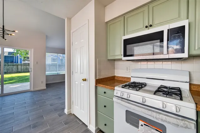 a kitchen with a sink cabinets and utility