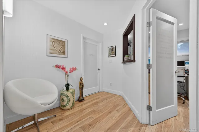 a view of a livingroom with furniture and entryway