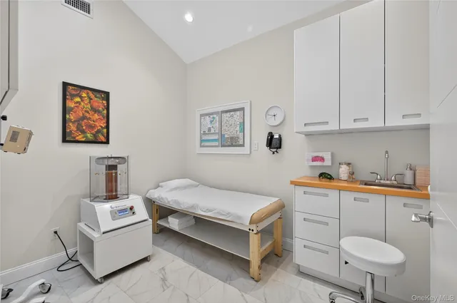 a room with a bed and a workspace