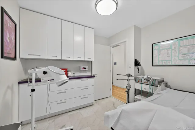 a bedroom with bed and window