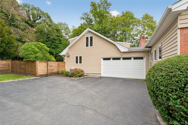 a view of backyard of house and green space