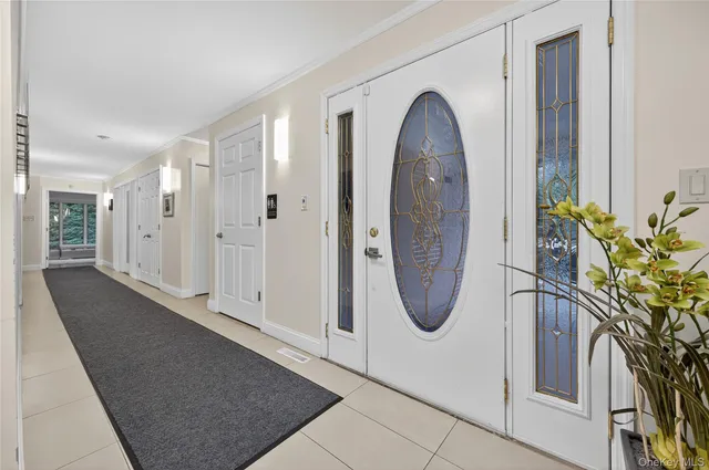 a view of a entryway door with wooden floor