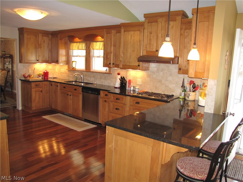 38836 Norwalk Road Litchfield, OH 44253 - Photo 5 of 27 Under cabinet lighting enhance your tile backsplash and workspace.