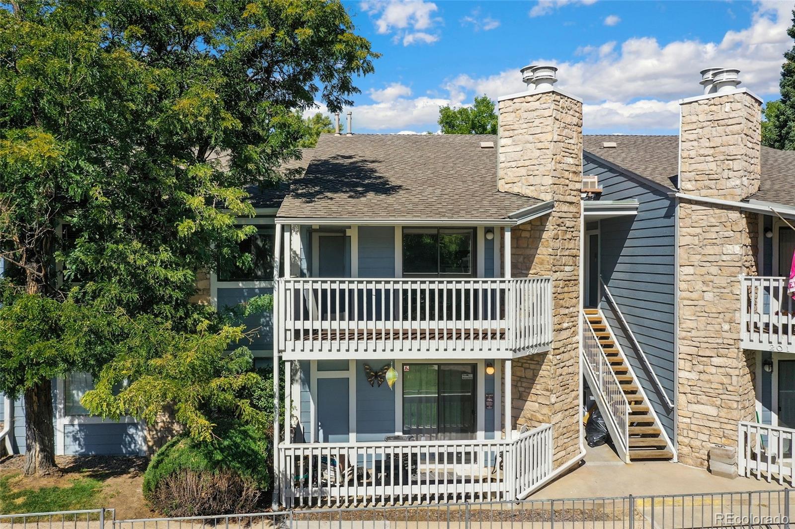 8335 Fairmount Drive, Unit 1202 Denver, CO 80247 - Photo 23 of 28 a view of a house with a deck