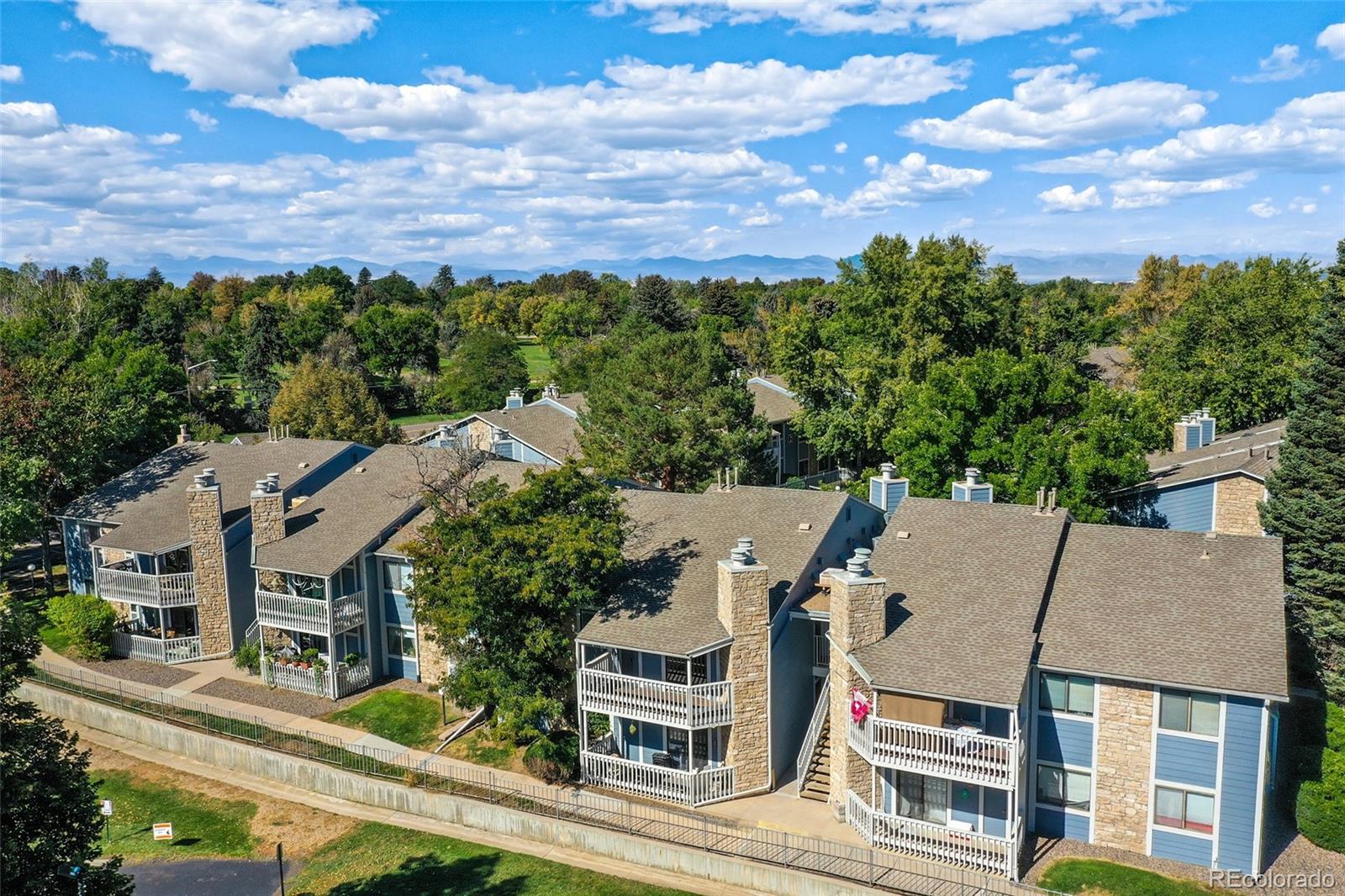 8335 Fairmount Drive, Unit 1202 Denver, CO 80247 - Photo 24 of 28 an aerial view of multiple houses