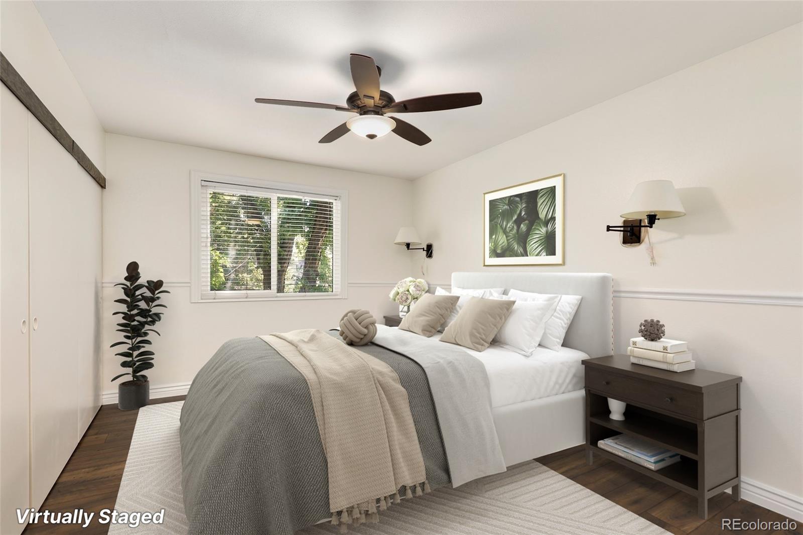 8335 Fairmount Drive, Unit 1202 Denver, CO 80247 - Photo 4 of 28 a bedroom with a bed a mirror and a window