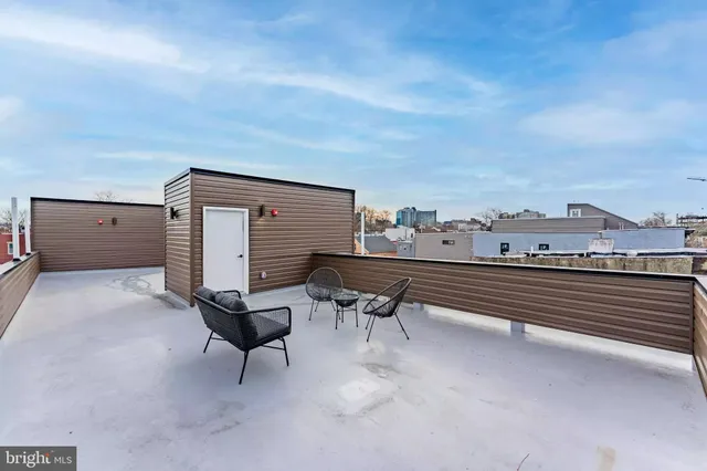a view of a terrace with sitting area