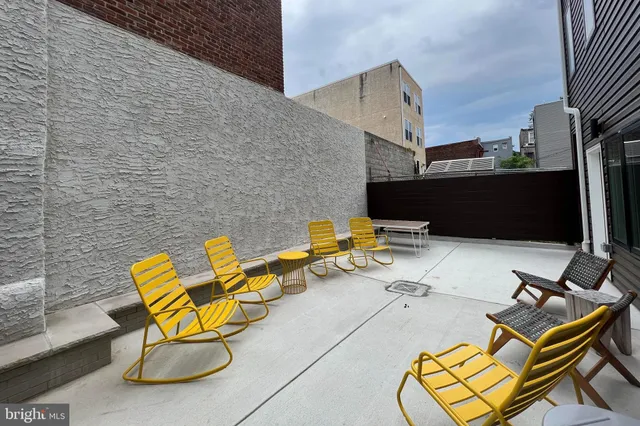 a view of a terrace with chairs